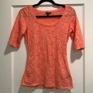 Express top size small in peach color. Flower design throughout.